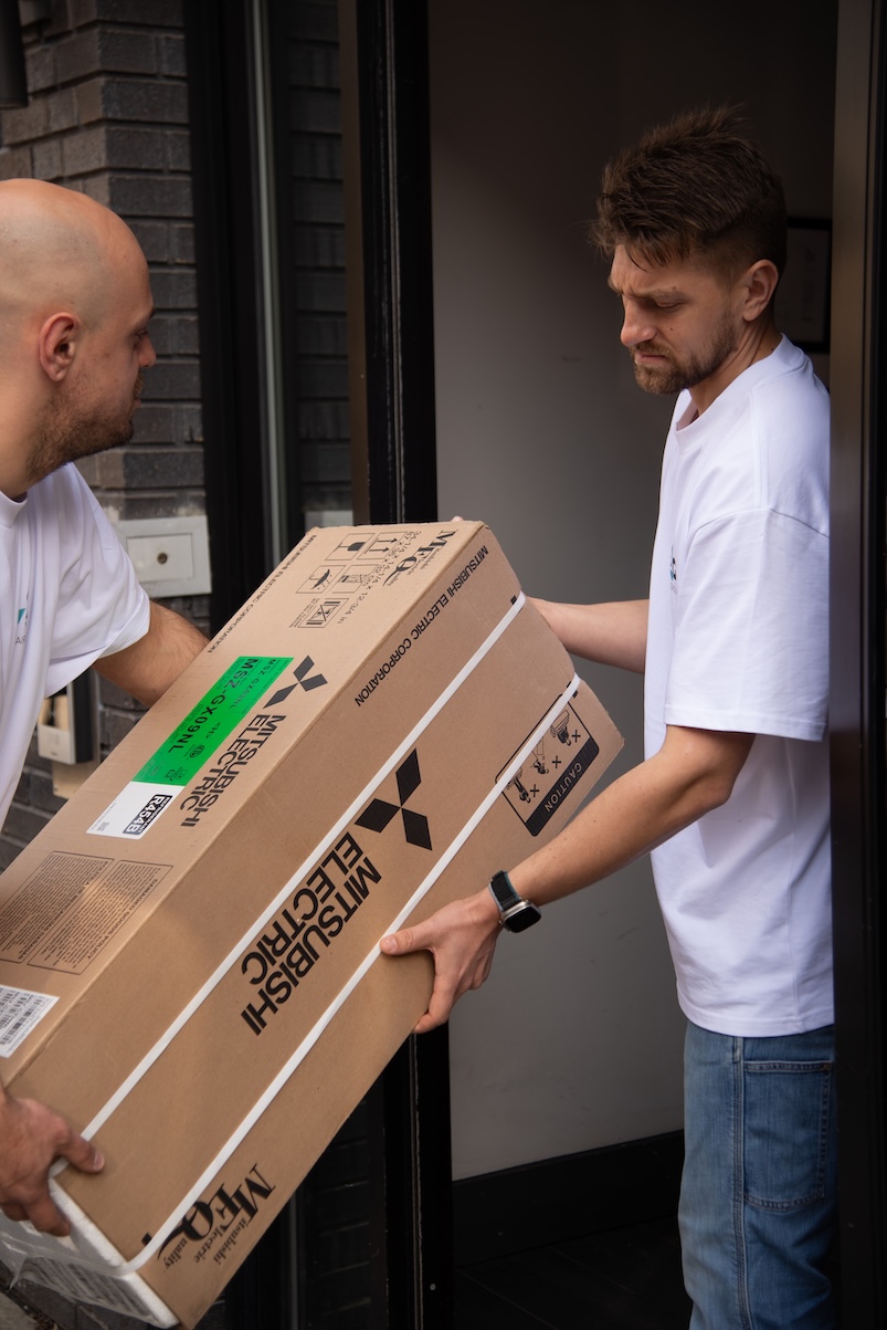 Team delivering Mitsubishi HVAC equipment for installation
