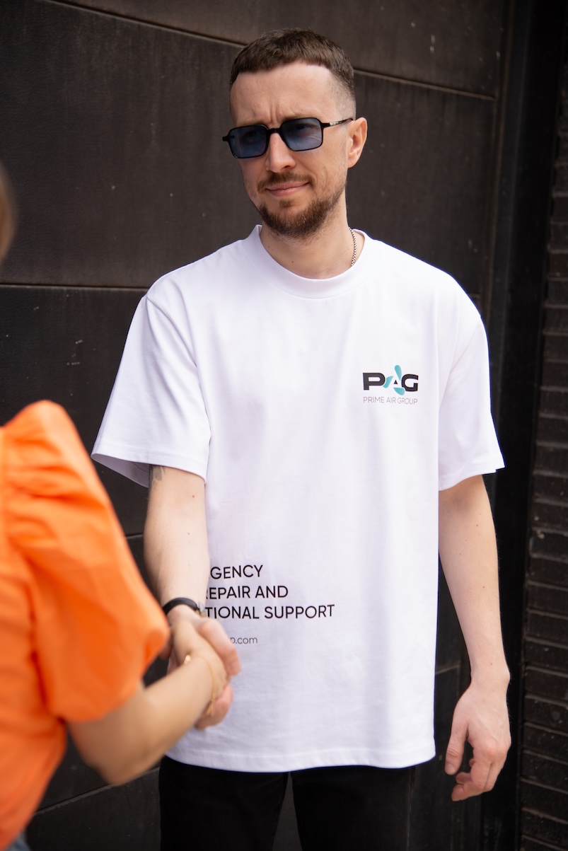 Prime Air Group technician greeting a client